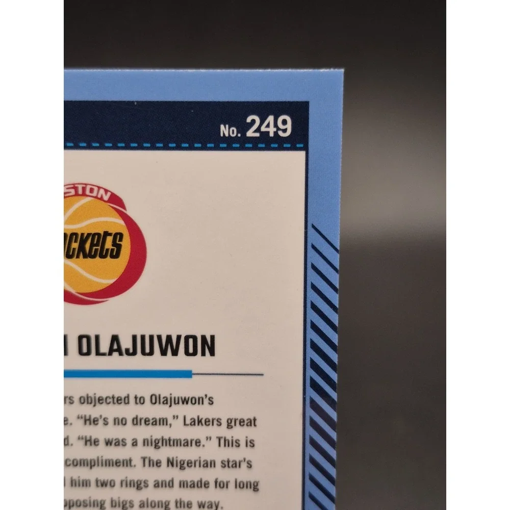 2024-25 Panini Optic Hakeem Olajuwon #249 Legends Red Seismic Prizm /149 Rockets